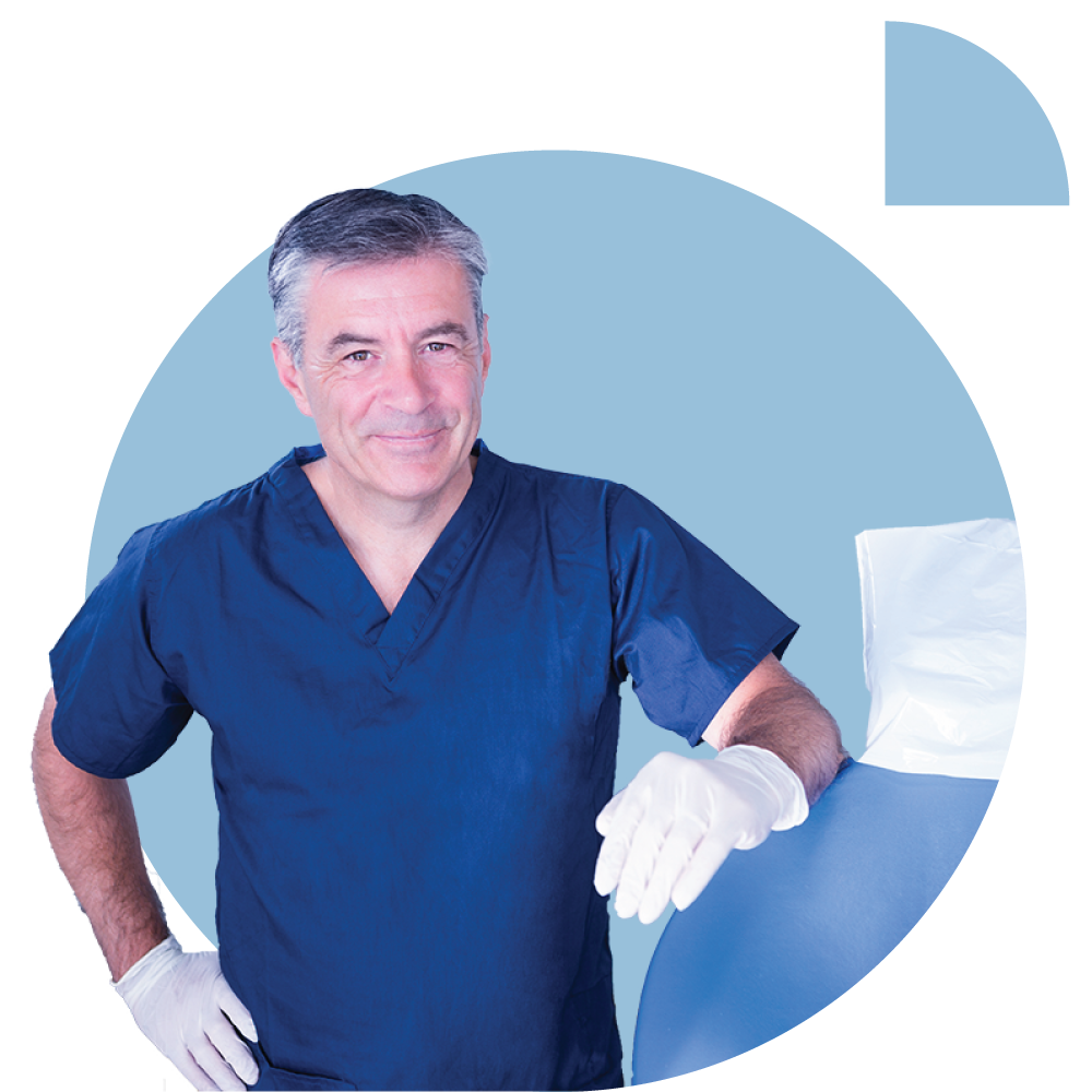 Dentist leaning against dental chair, smiling