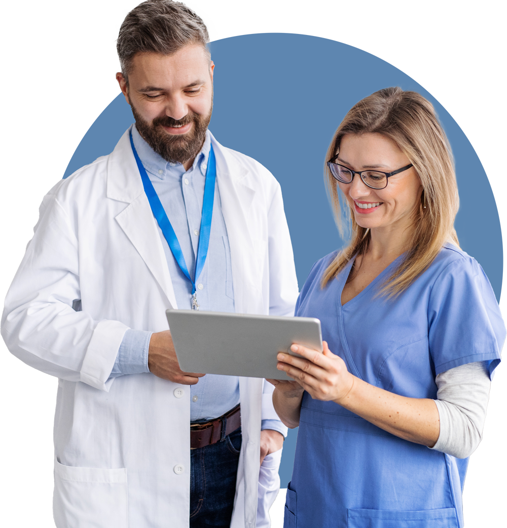 Dentist and assistant looking at tablet